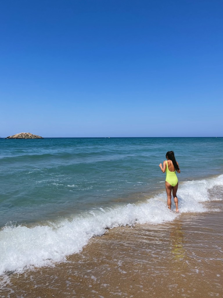 Running into the ocean at a beach near Heraklion