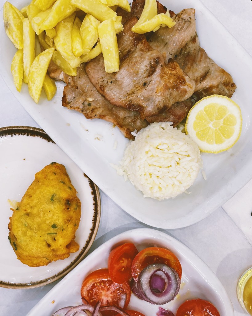 Scenes from a meal at Tasca Zé dos Cornos in Lisbon, Portugal